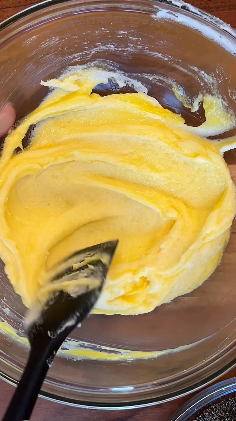 Wet mixture after adding egg yolks to the creamed butter and sugar