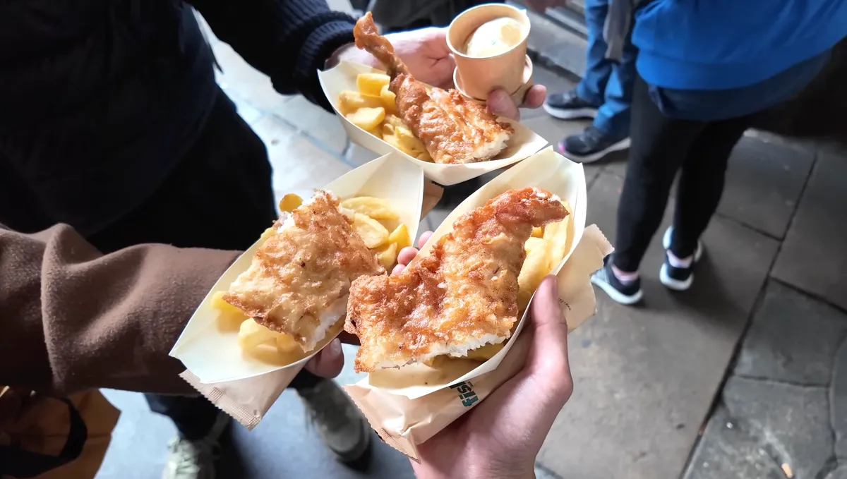 Fish Kitchen award-winning fish and chips held in paper trays at Borough Market