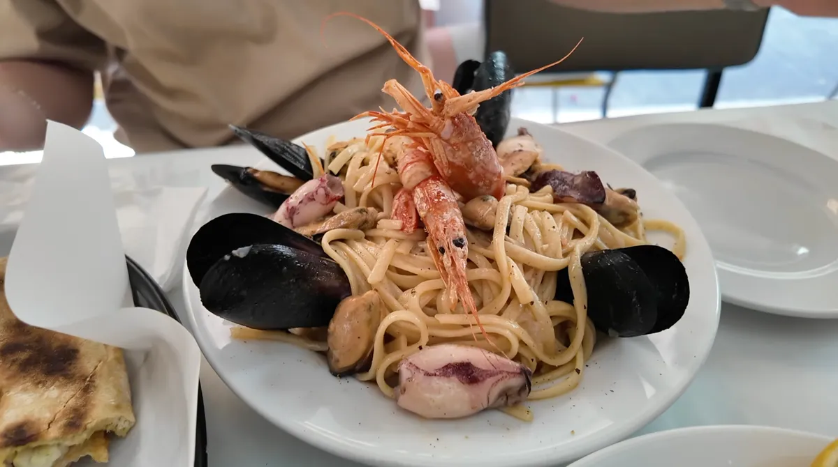 Seafood pasta piled high with shrimp, mussels, and calamari at Ristorante Atlantikos in Athens